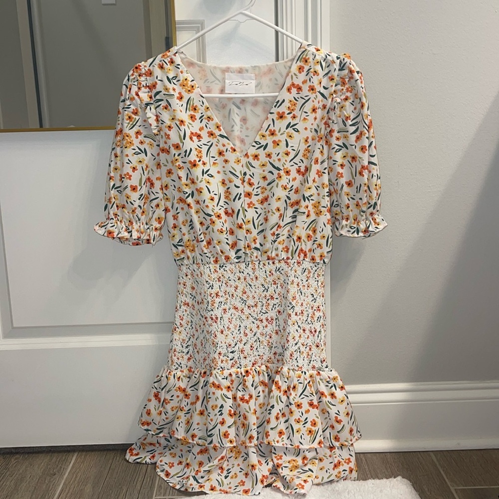 DeeDee mini dress with puff sleeves and cinched waist! So cute Never Worn!